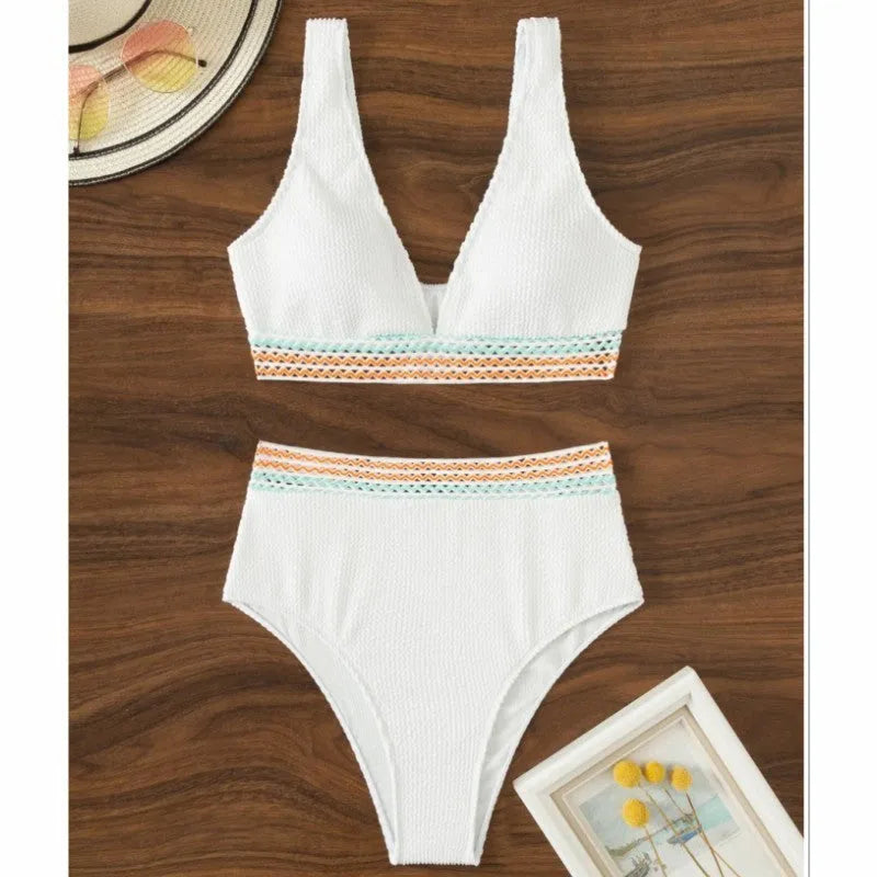 Women's high waist solid colour bikini set in white or pink, made from nylon fabric.