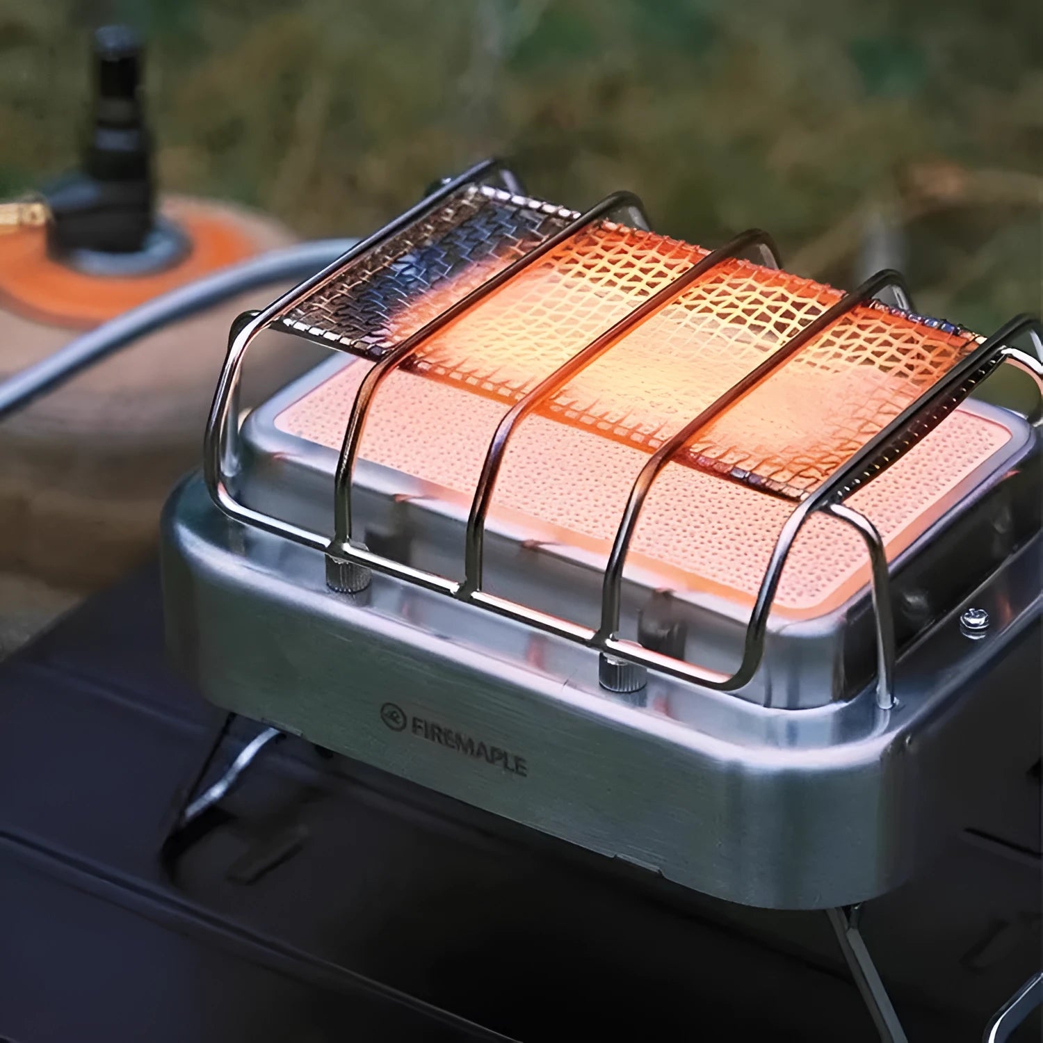 Outdoor heating stove with voltage regulator showing metal construction and compact folded design
