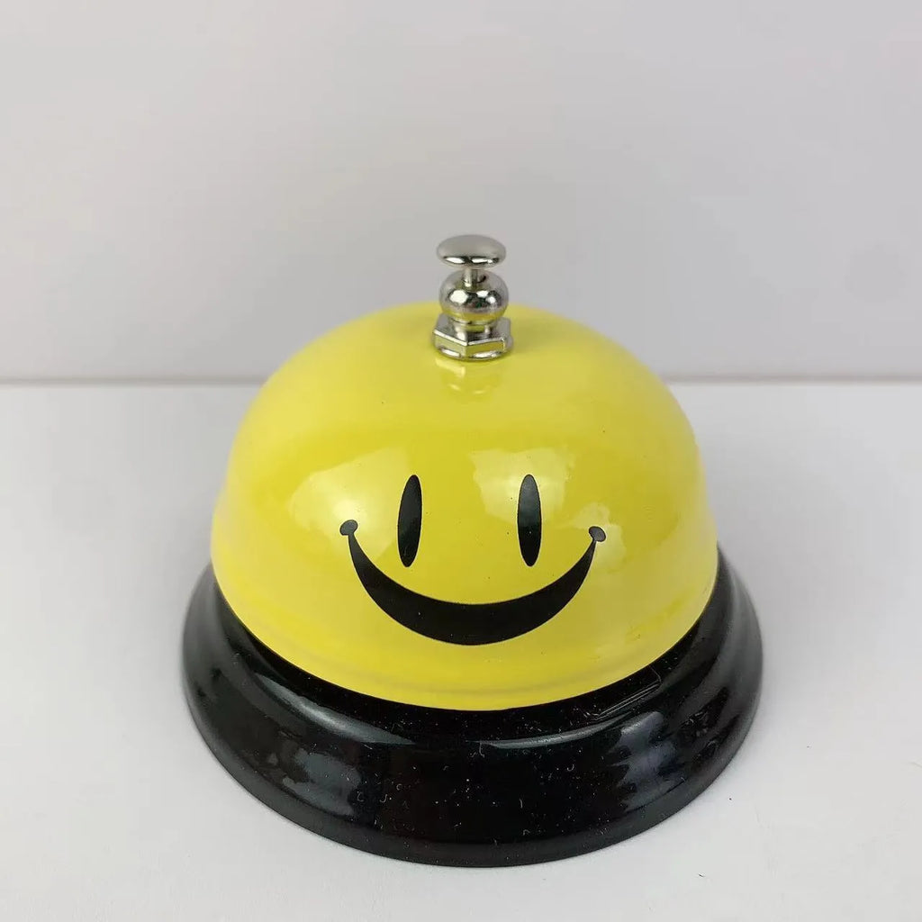 Iron game bell in assorted colours including red, blue, green, pink, and yellow for service or classroom use.