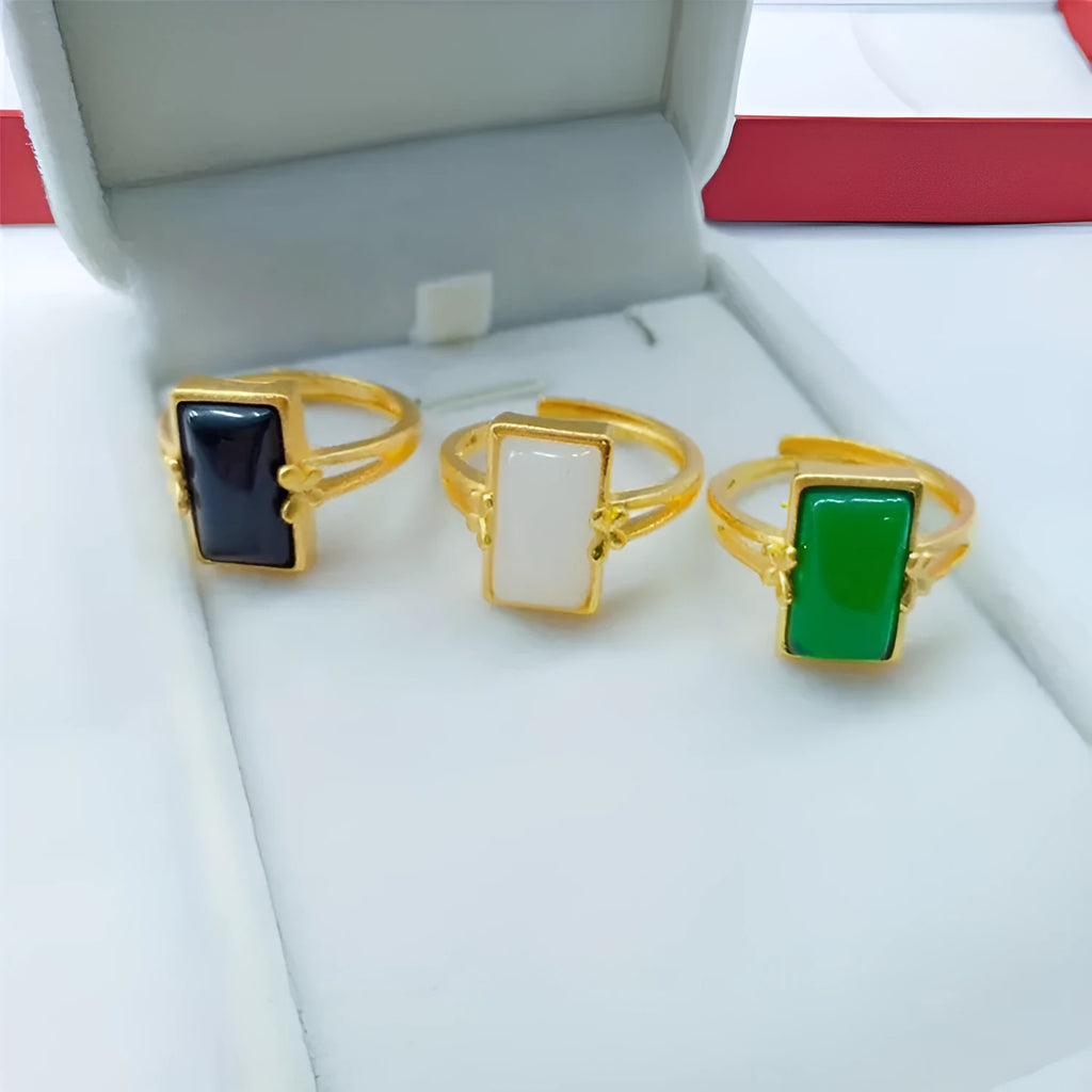 Gold-plated brass adjustable ring with a choice of black, green, or white gemstone inlays.