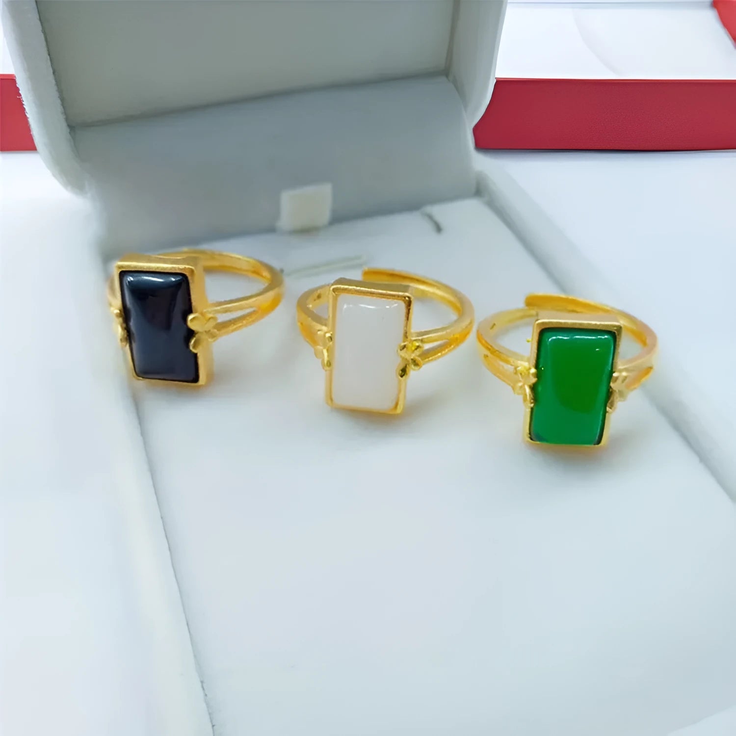 Gold-plated brass adjustable ring with a choice of black, green, or white gemstone inlays.