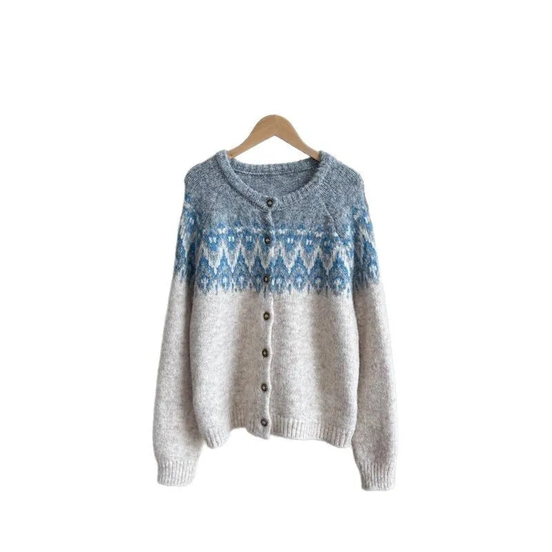 Women's loose fit jacquard knit sweater coat in contrast colours, showing long sleeves and textured pattern.