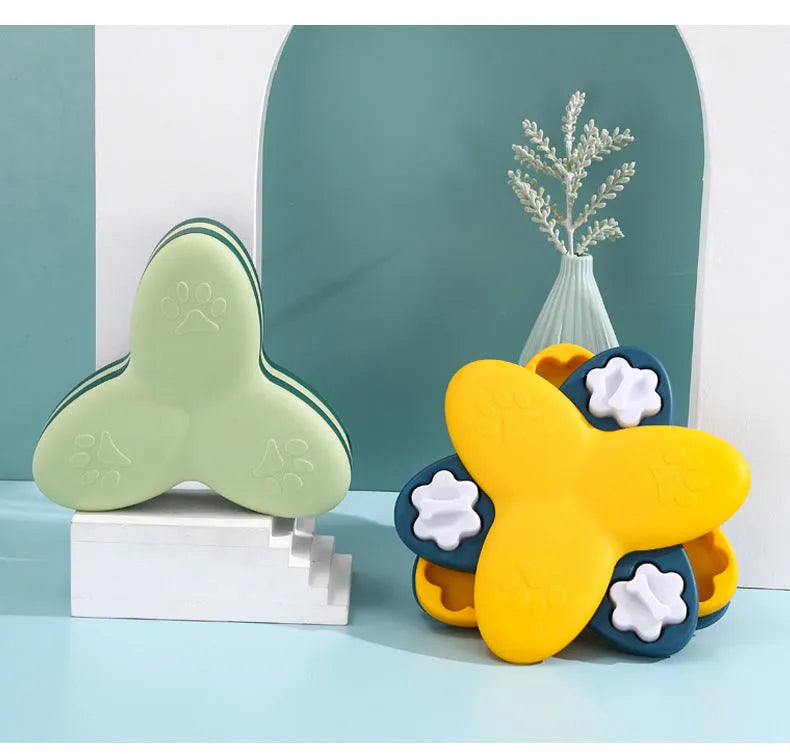 Green and yellow interactive dog puzzle toy slow feeder bowl with nine bone-covered compartments.