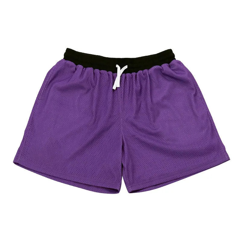 Men's solid colour quick-drying mesh sports shorts in black, shown for running.