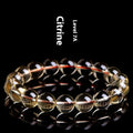 Natural citrine scattered beads ball bracelet showing golden polished stones on a wrist, available in 7A and 6A grades.
