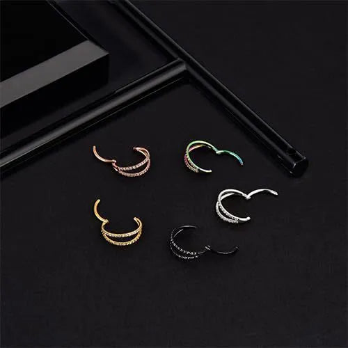 G23 titanium alloy puncture-style nose ring on a plain background showing steel and gold colour options.