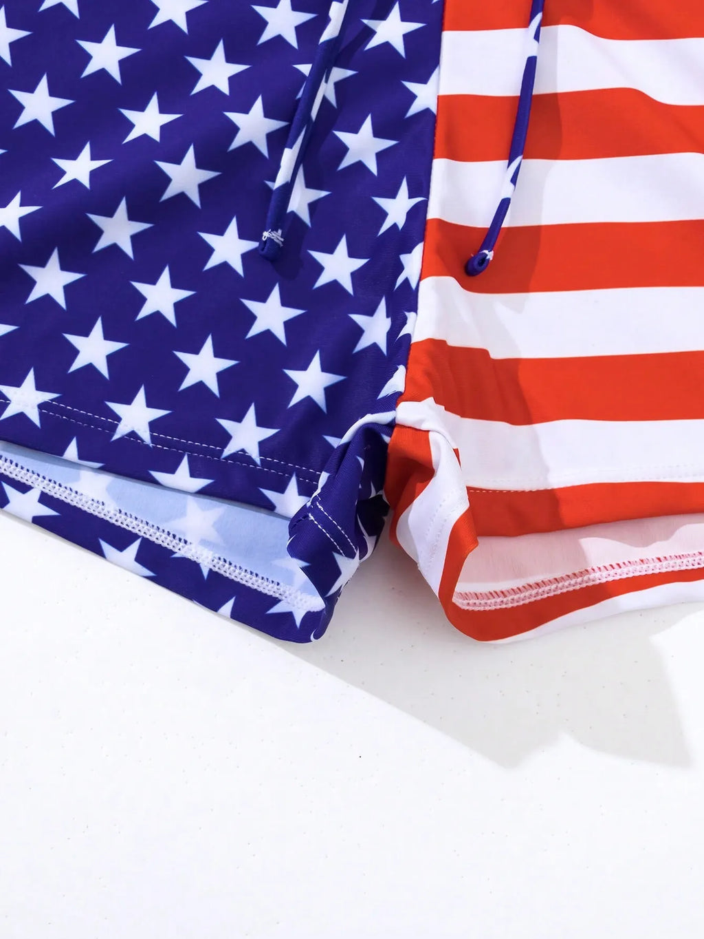 Women's high waist boxer swimsuit with drawstring in red, white, and blue Stars and Stripes pattern.