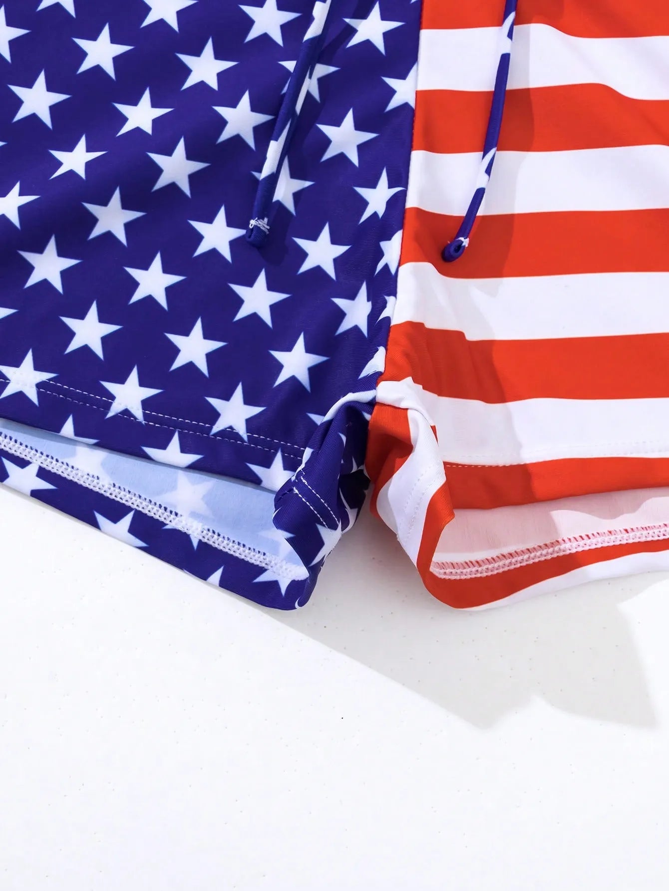 Women's high waist boxer swimsuit with drawstring in red, white, and blue Stars and Stripes pattern.