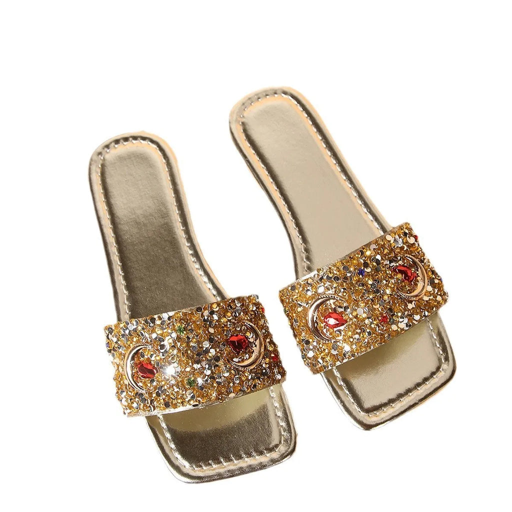 Gold women's flat slippers with rhinestone sequin decoration on the upper.