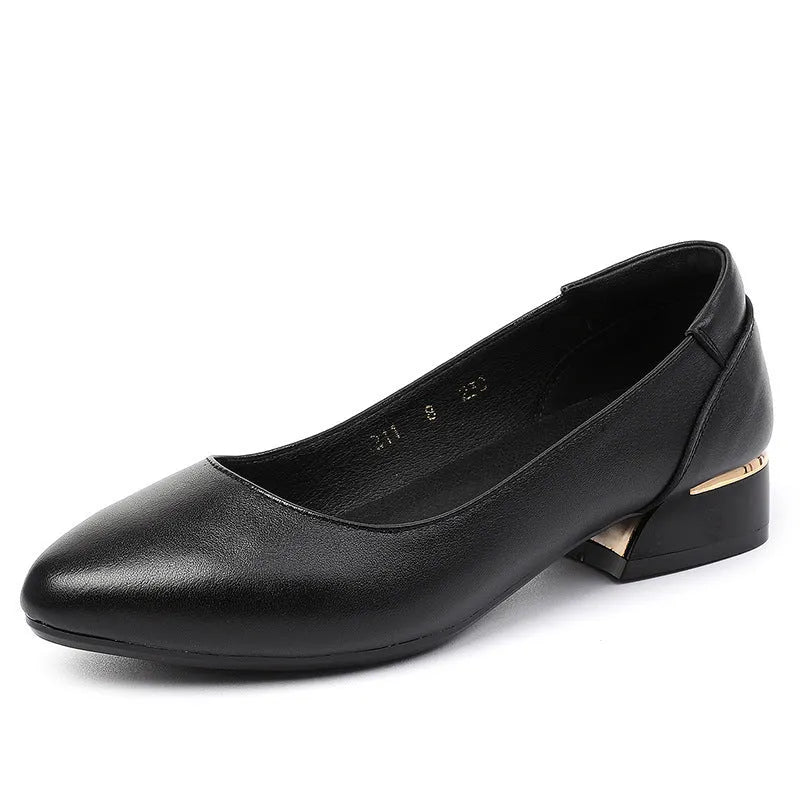 Beige low top casual shoes with pointed toe, buckle fastening, and a thick flat heel.