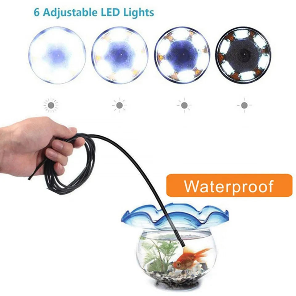USB endoscope with flexible cable, camera head, magnet, hook, and side mirror attachments on a table.