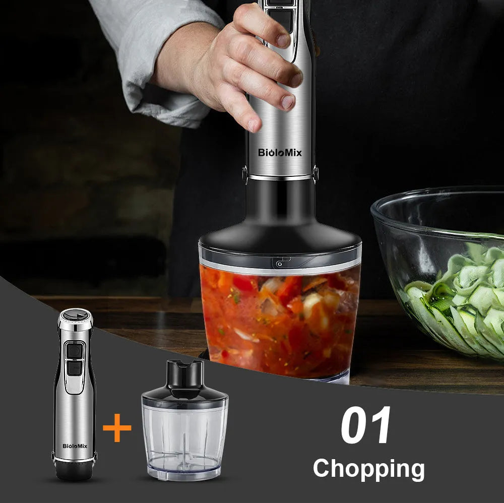 Silver Biolomix hand blender kit with motor unit, stainless steel shaft, whisk, chopper bowl, and blending beaker.