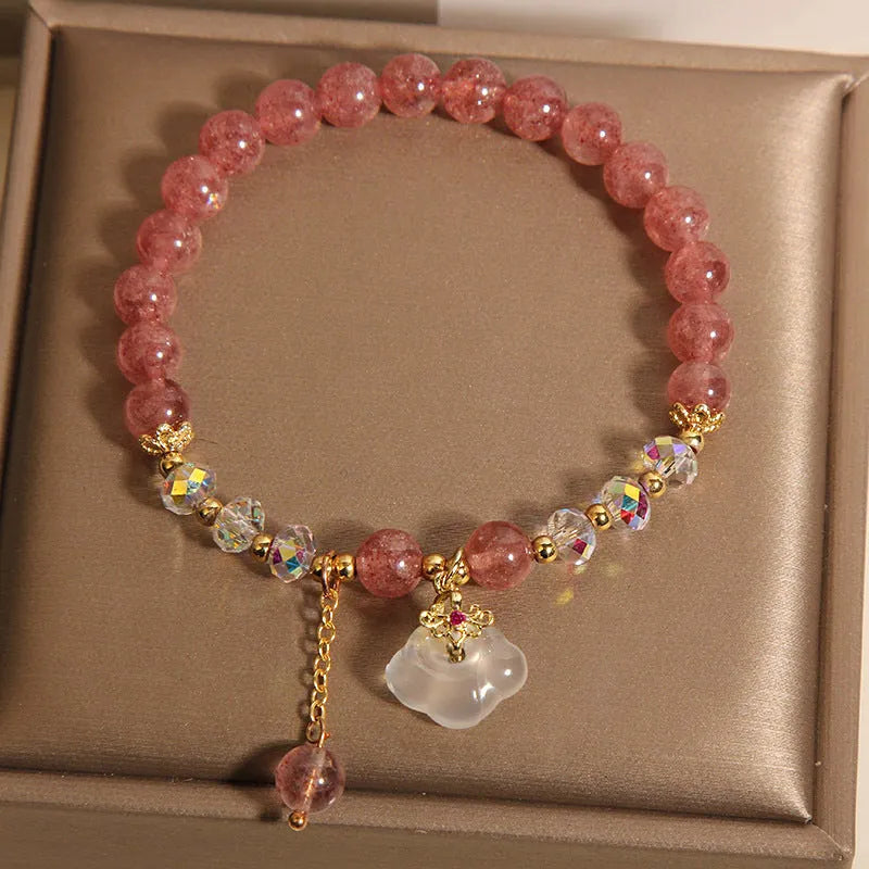 Women's adjustable crystal bracelet with strawberry quartz and white agate beads featuring auspicious cloud charm