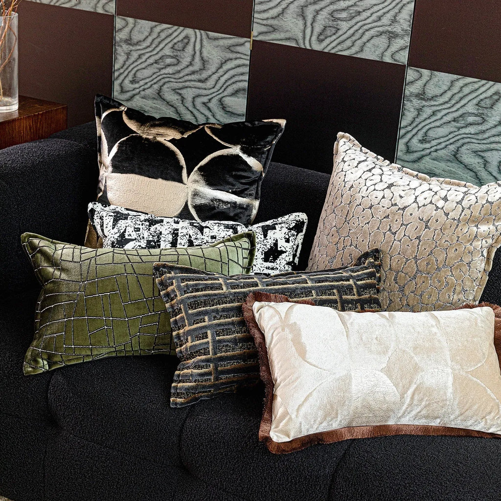 Black and gold abstract pattern flannel cushion cover on a sofa