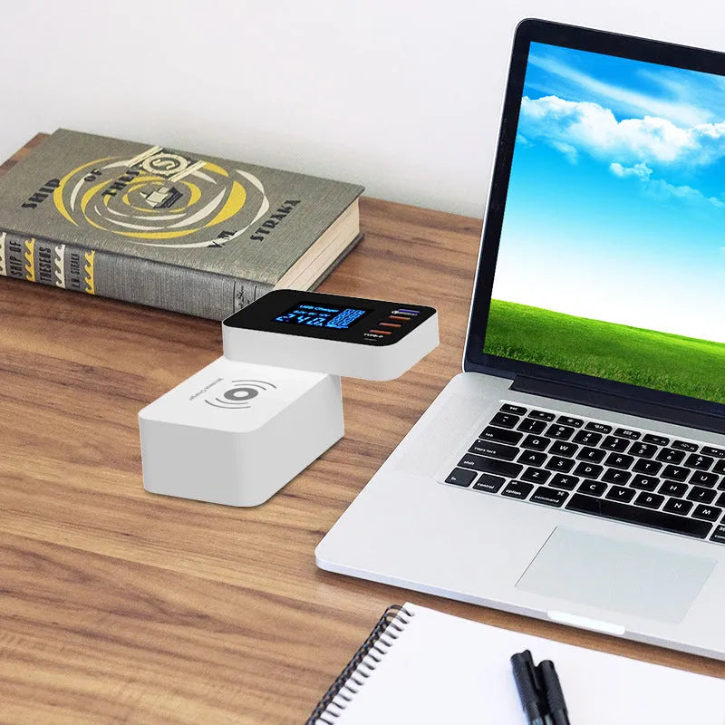 White multi-port USB wall charger with wireless charging pad and UK plug on a 1.5 metre cable.