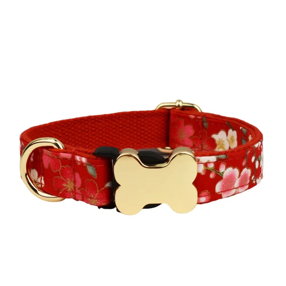 Flat nylon dog collar with printed grid pattern and white bone-shaped plastic buckle on a blue background.