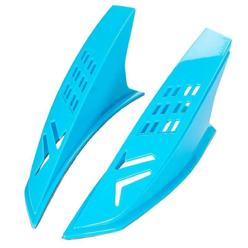 A pair of black plastic decorative horns for children's helmets with visible 3M adhesive backing.
