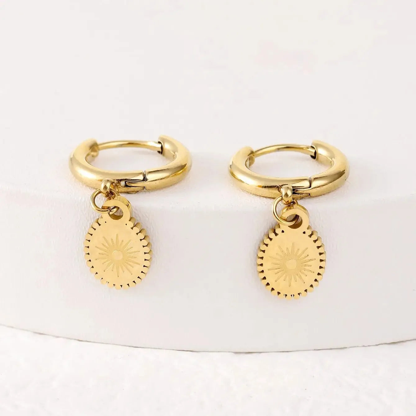 Women's geometric stainless steel earrings with oval accent shapes and ear button fastening