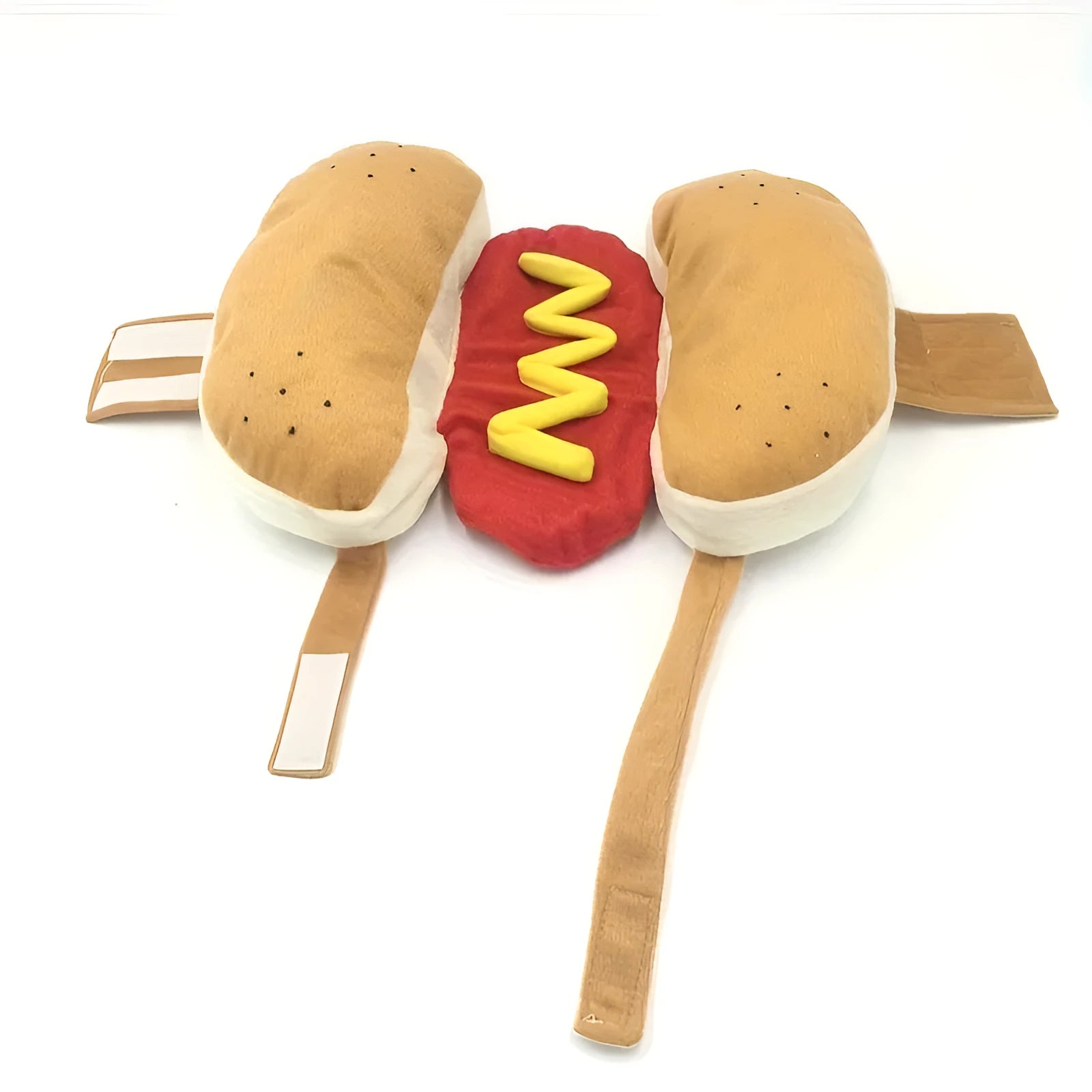 A small dog wearing a red and brown plush hot dog costume with a hood and leg openings.