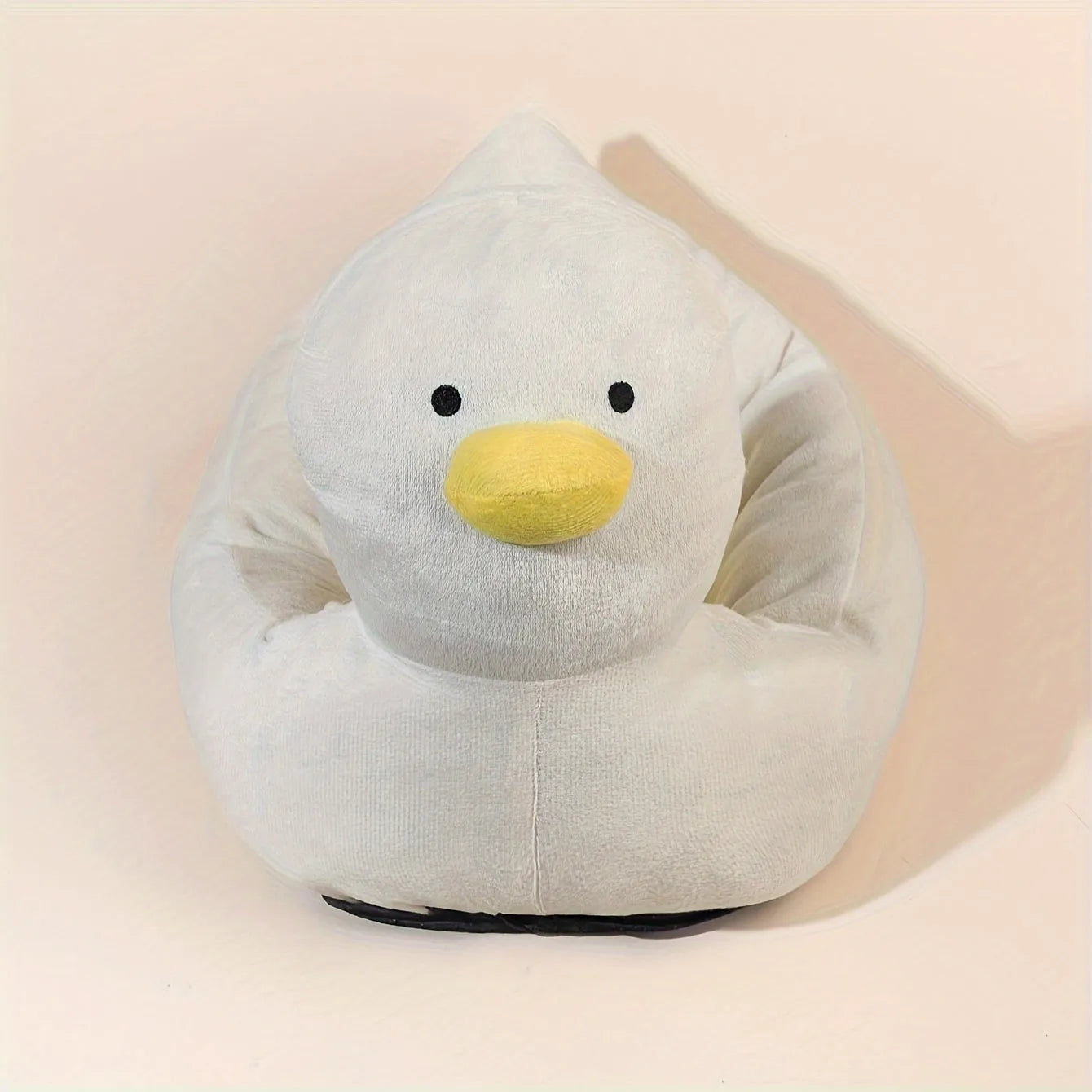 Blue duck-shaped fluffy pet bed sofa for small dogs and cats on wooden floor