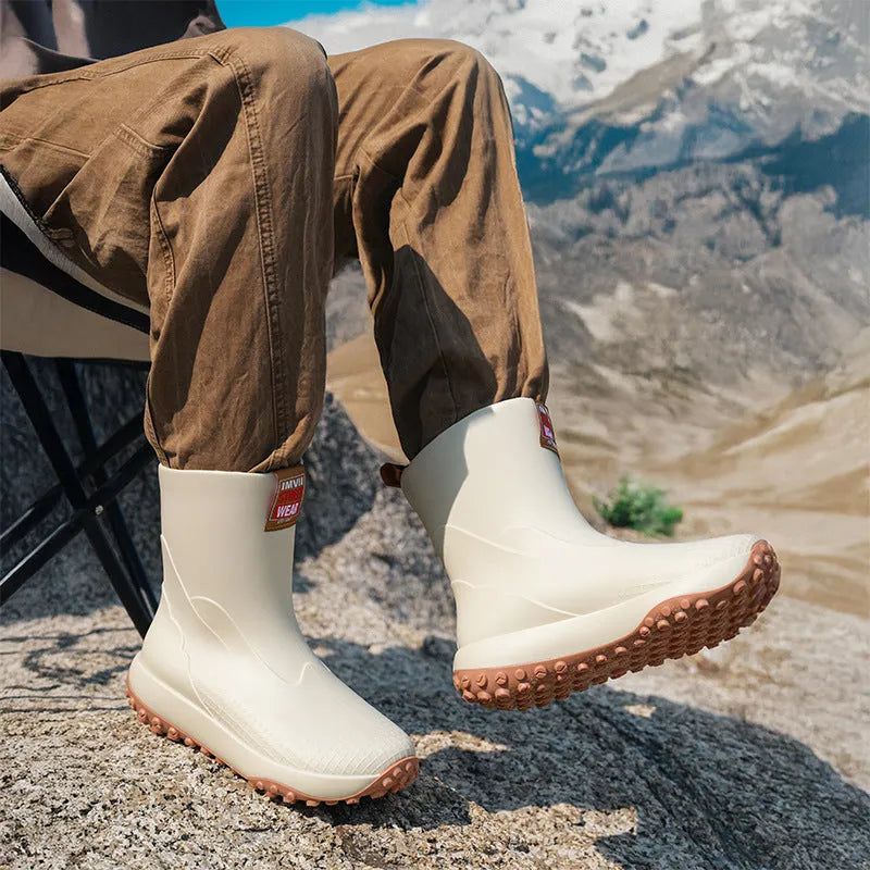 Men's mid-height PVC rain boot in beige colour with a round toe and plastic sole.