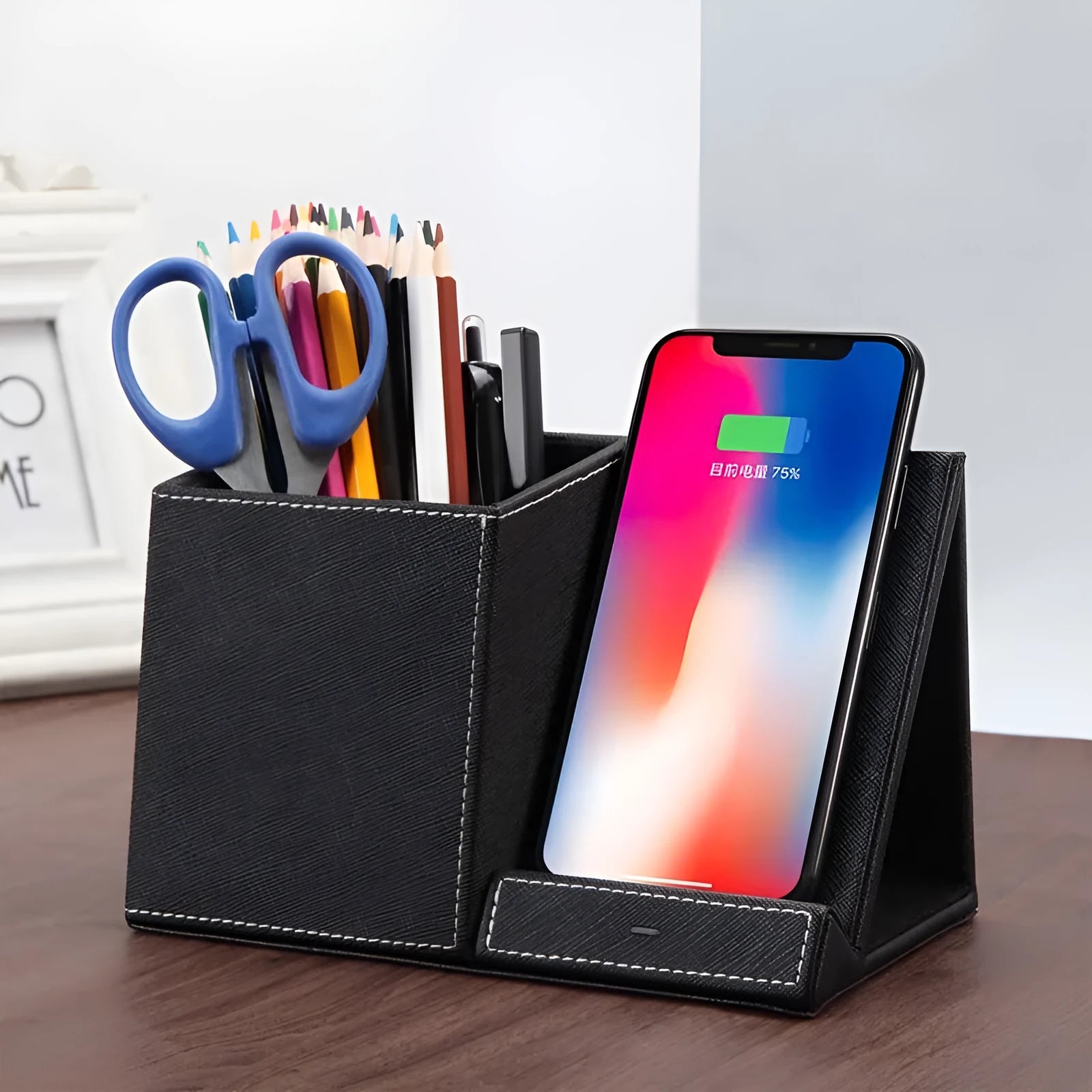 Black leather pen holder wireless charging station for desk organisation with phone charging surface