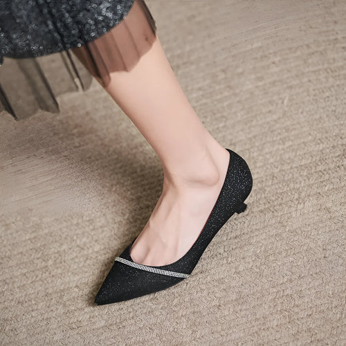 Black sequined women's high heel shoes with a 7cm thin stiletto heel on a neutral background.