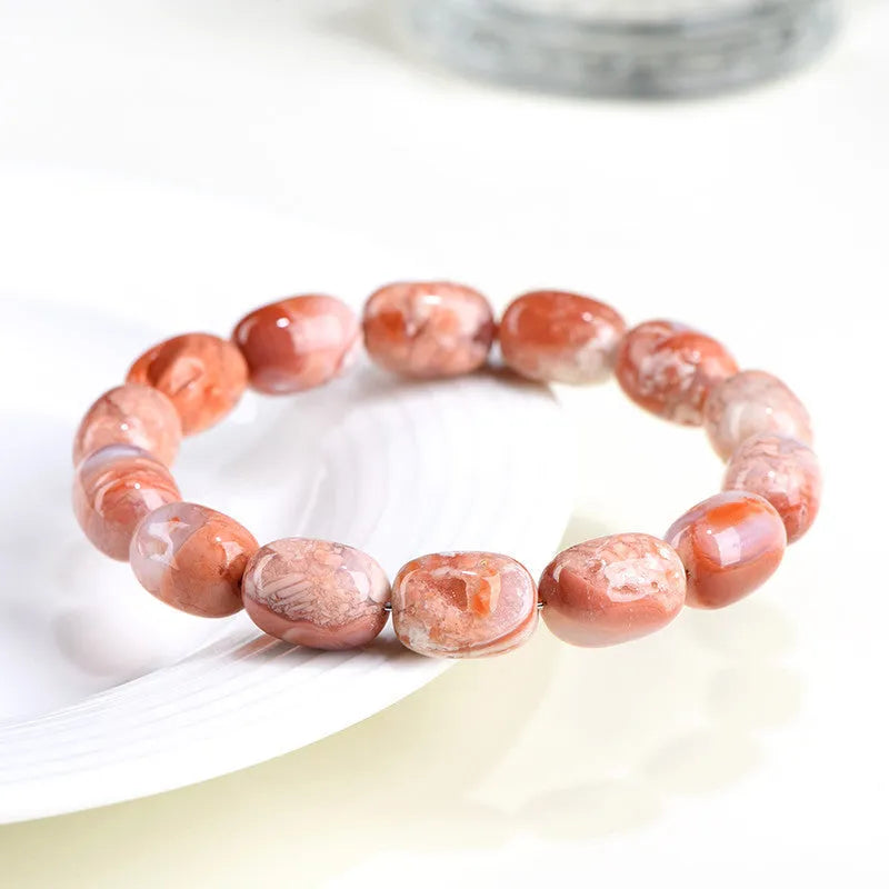 Natural cherry agate bracelet with 10x14mm barrel beads in geometric design