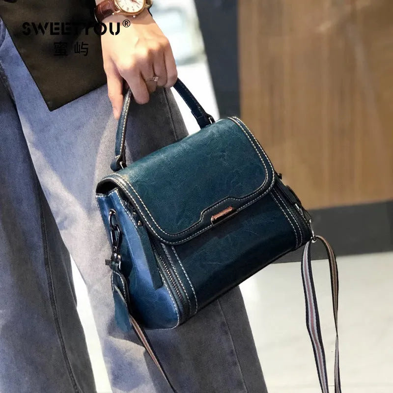 Genuine leather women's vintage messenger bag with multiple internal compartments in caramel colour
