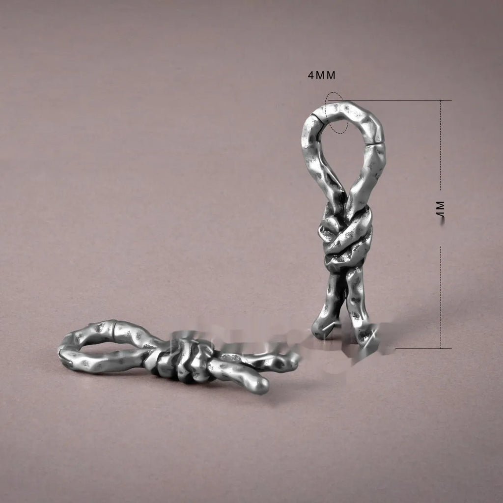 Close-up of 4mm copper bending and connecting earrings for auricle piercings.