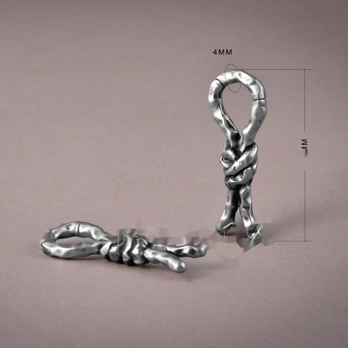 Close-up of 4mm copper bending and connecting earrings for auricle piercings.