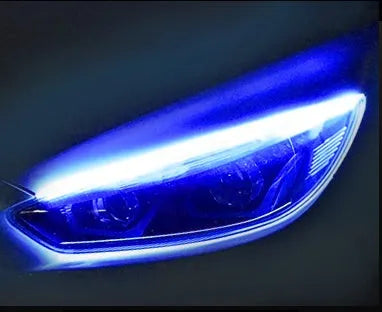 Flexible silicone car LED light strip for daytime running and flowing turn signals, showing wire connections.
