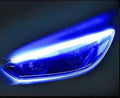 Flexible silicone car LED light strip for daytime running and flowing turn signals, showing wire connections.