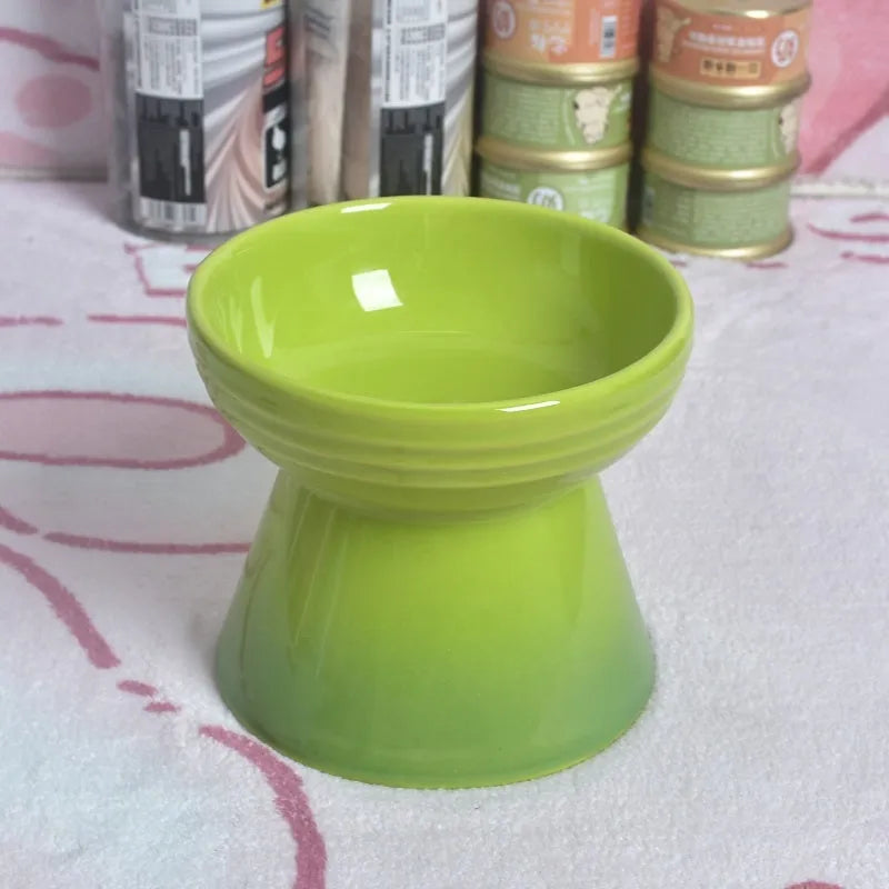 White ceramic pet bowl with a high foot neck and slanted rim for cat or dog feeding