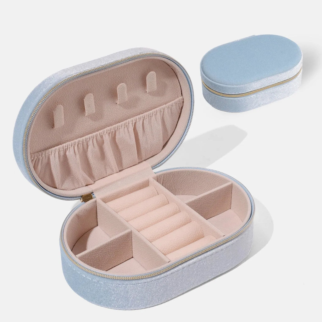 Oval velvet jewellery storage box in lake blue with internal hook for necklaces.