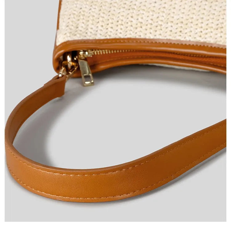 Khaki coloured hand-woven straw selenodon crossbody bag with a single shoulder strap