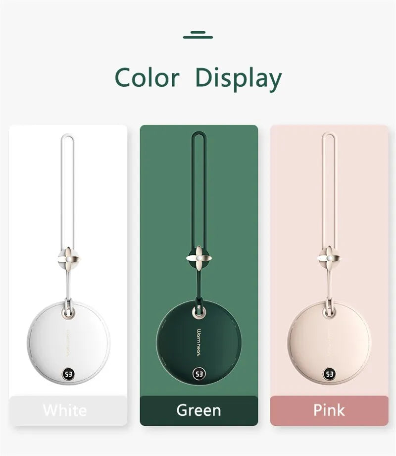 Green square hand warmer power bank with digital display showing charge level, next to a charging cable.