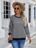 Black long sleeve pullover sweater with a classic plaid stripe print pattern.