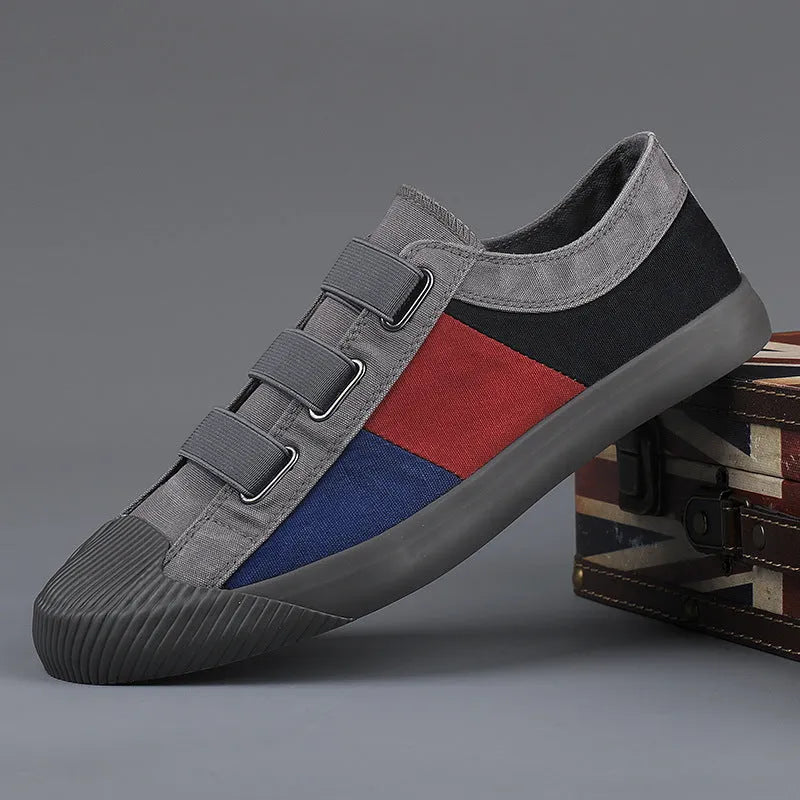 Men's canvas sneakers with rubber sole in multiple colour options showing low top design and elastic band