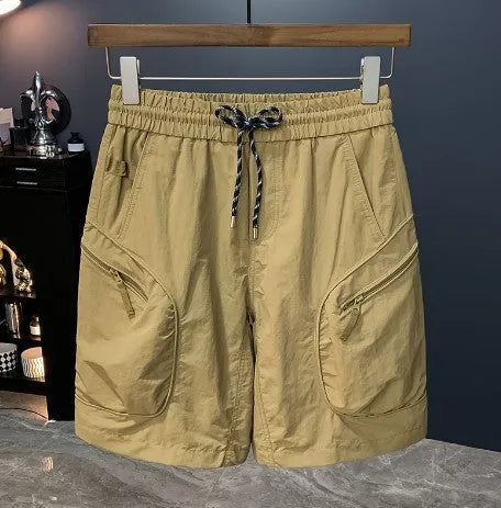 Man wearing loose-fit camouflage cargo shorts with cargo pockets and an elasticated waistband.