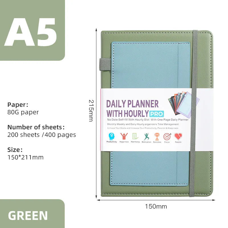 A5 notebook with PU leather cover in matcha green, lying open on a desk
