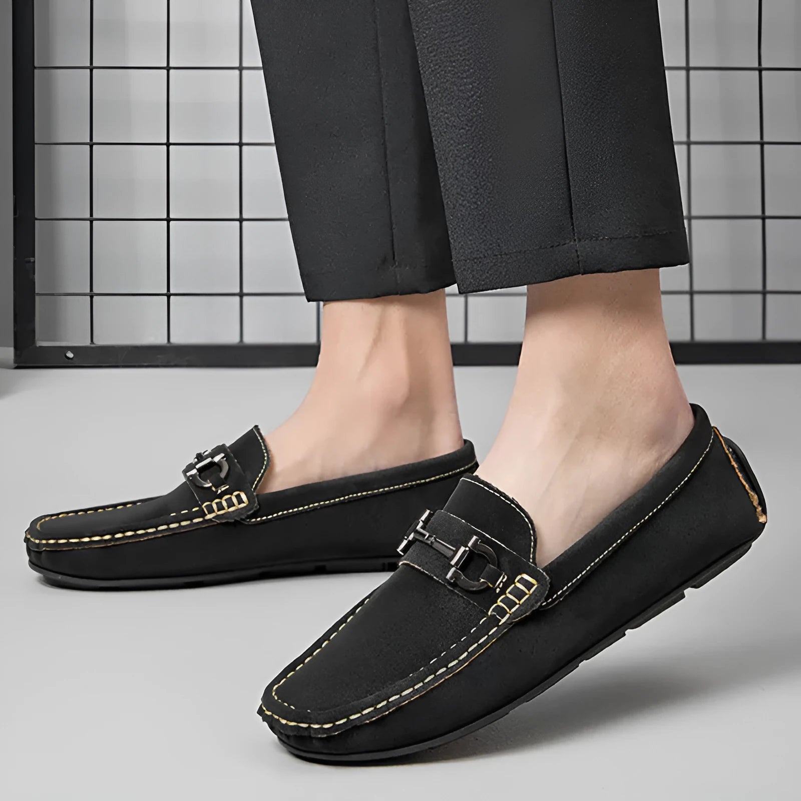 Men's beige cowhide leather slip-on loafers with round toe and rubber sole on a neutral background.