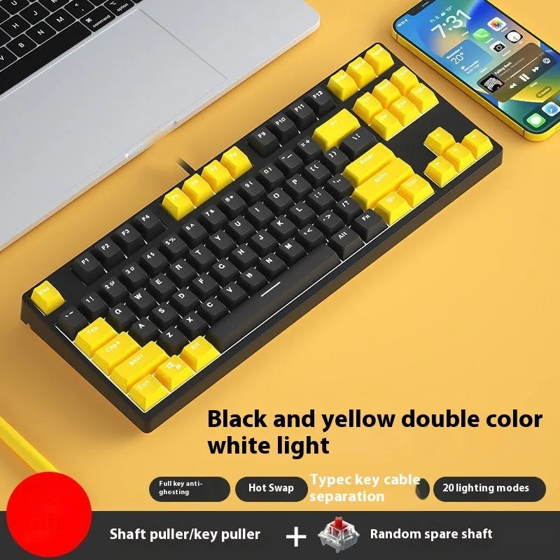 87-key wired mechanical keyboard with two-tone keycaps, shown with switch puller and cleaning brush