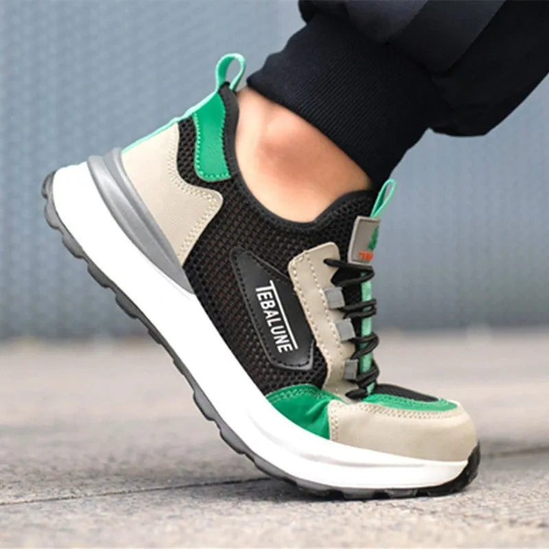 Black and green low-top safety shoes with a mesh panel and plastic steel toe cap on a TPU sole.