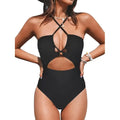Women's backless solid colour one-piece swimsuit on a hanger