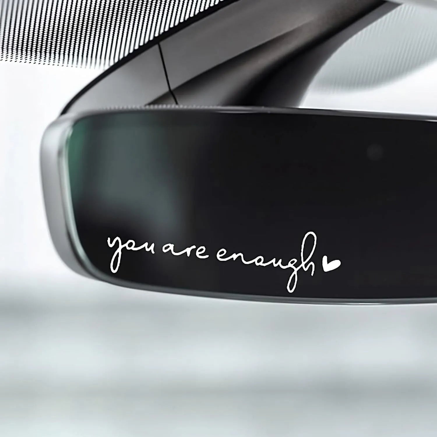Plastic rearview mirror sticker 10x3cm in black on a car mirror