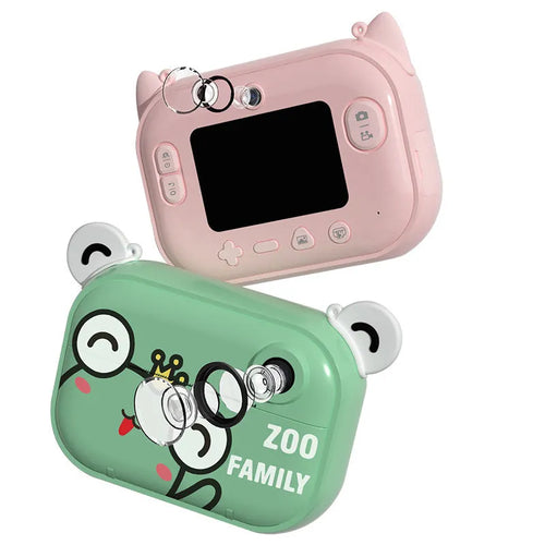 Pink C3 instant print digital camera with 2.4-inch screen, placed alongside included printing paper, stickers, and accessory pack