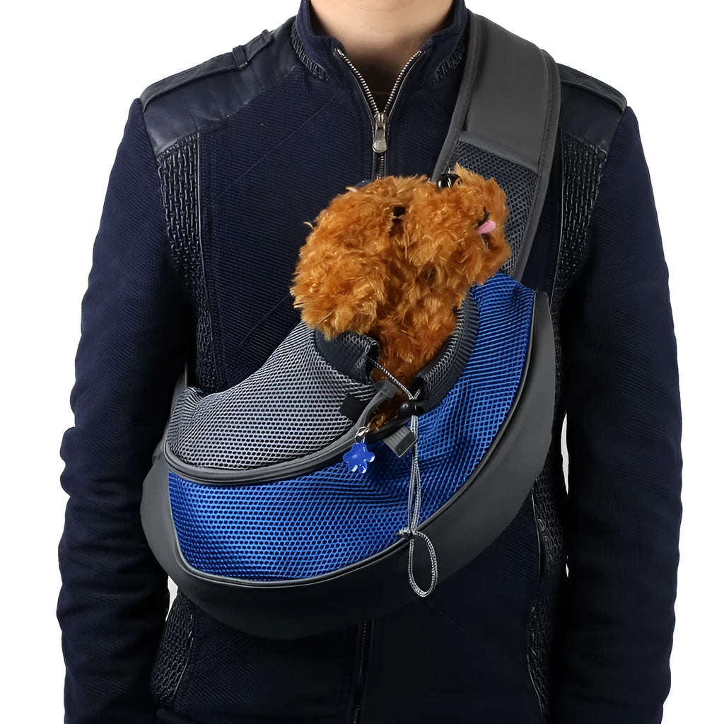Blue pet carrier backpack for a small dog, showing padded interior and shoulder straps.