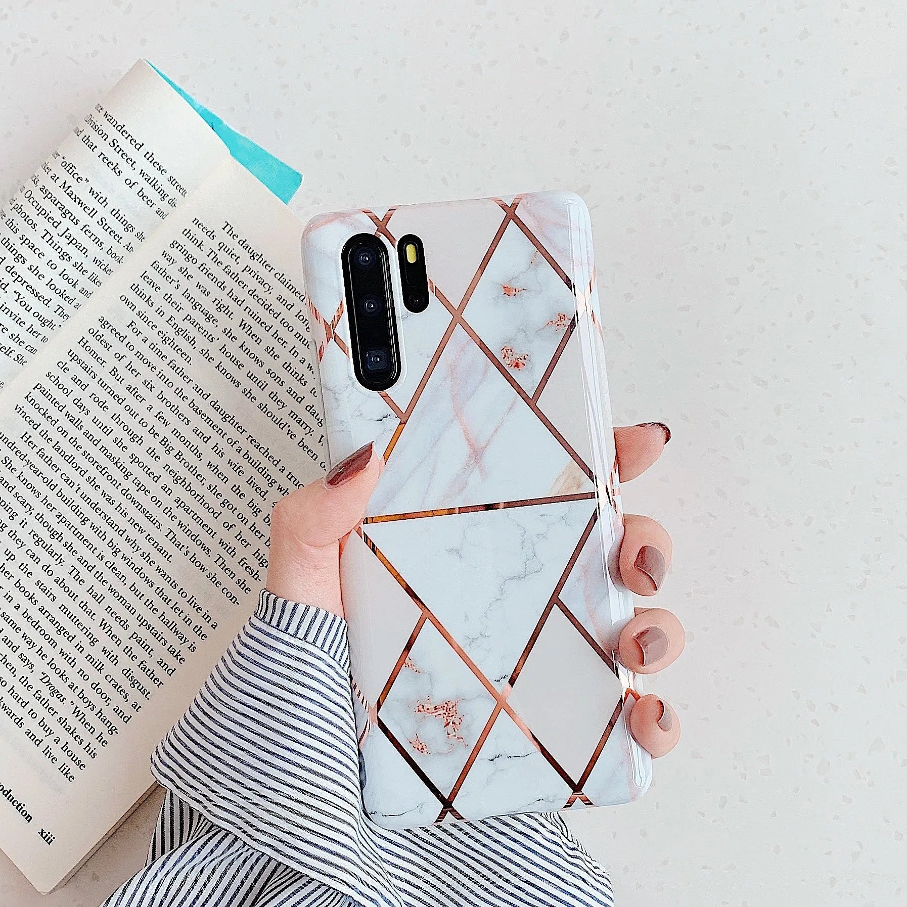 Electroplated marble pattern TPU back cover case for a Huawei or Samsung smartphone.