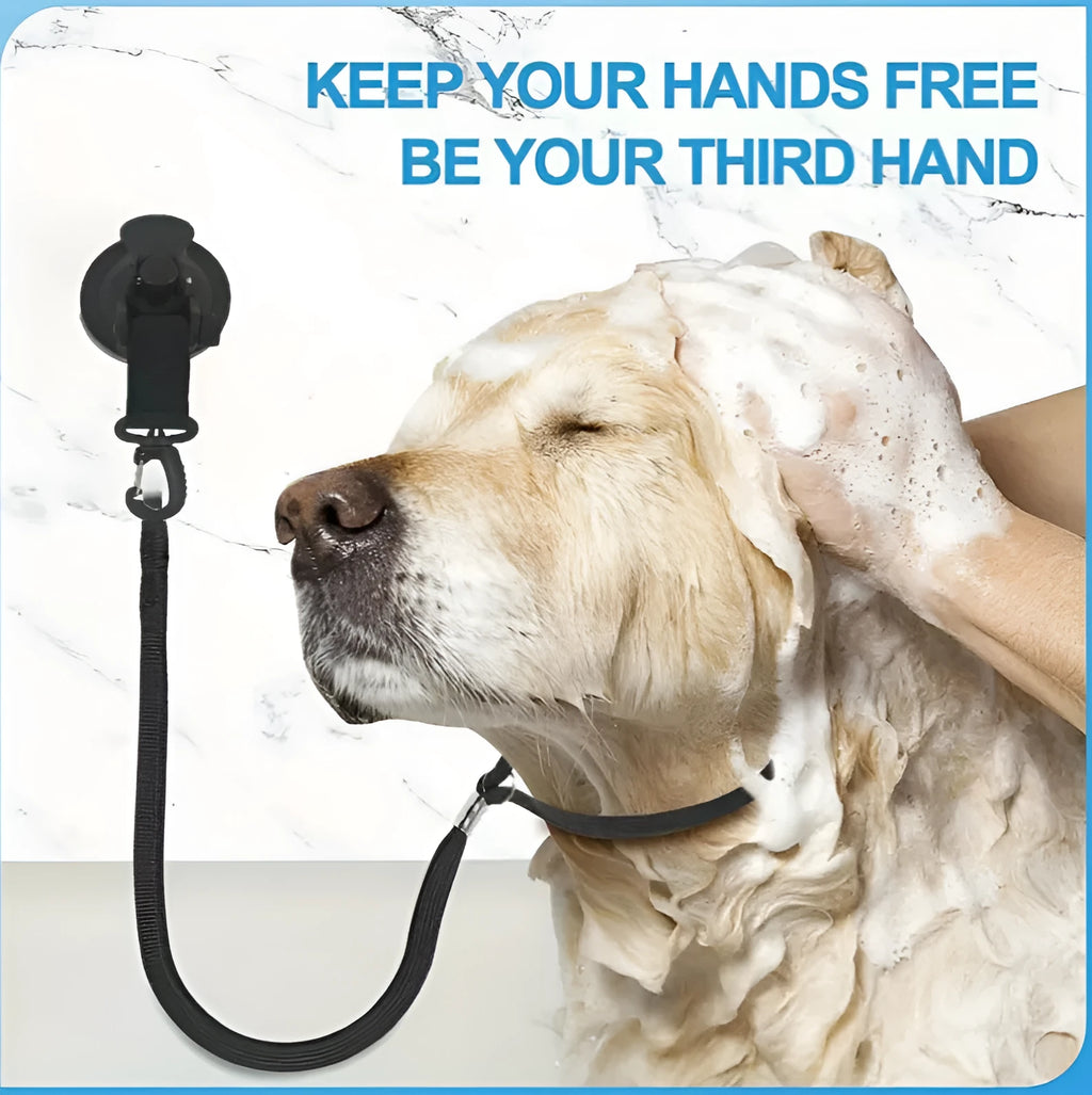 Pet bath restraint kit with four blue suction cup handcuffs and a connecting rope on bathroom tiles.